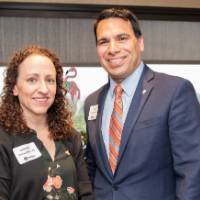 man and woman smile for picture